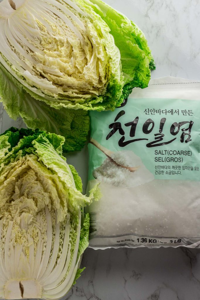 Napa cabbage with a bag of Korean coarse sea salt on the side