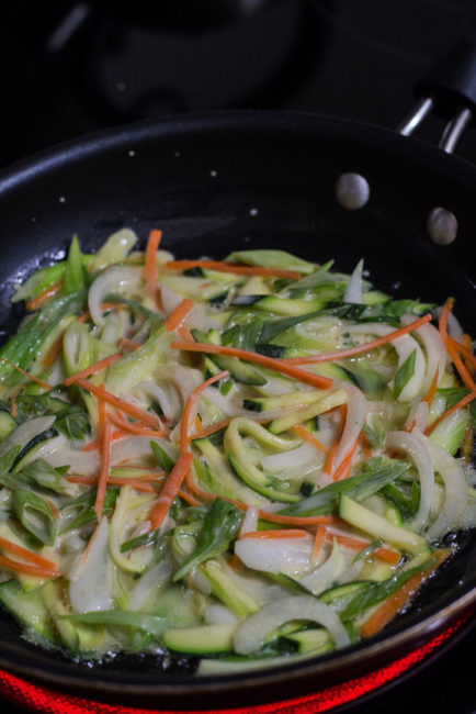 pan-frying the savory Korean pancake