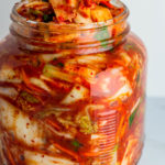 Vegan kimchi in a big clear jar