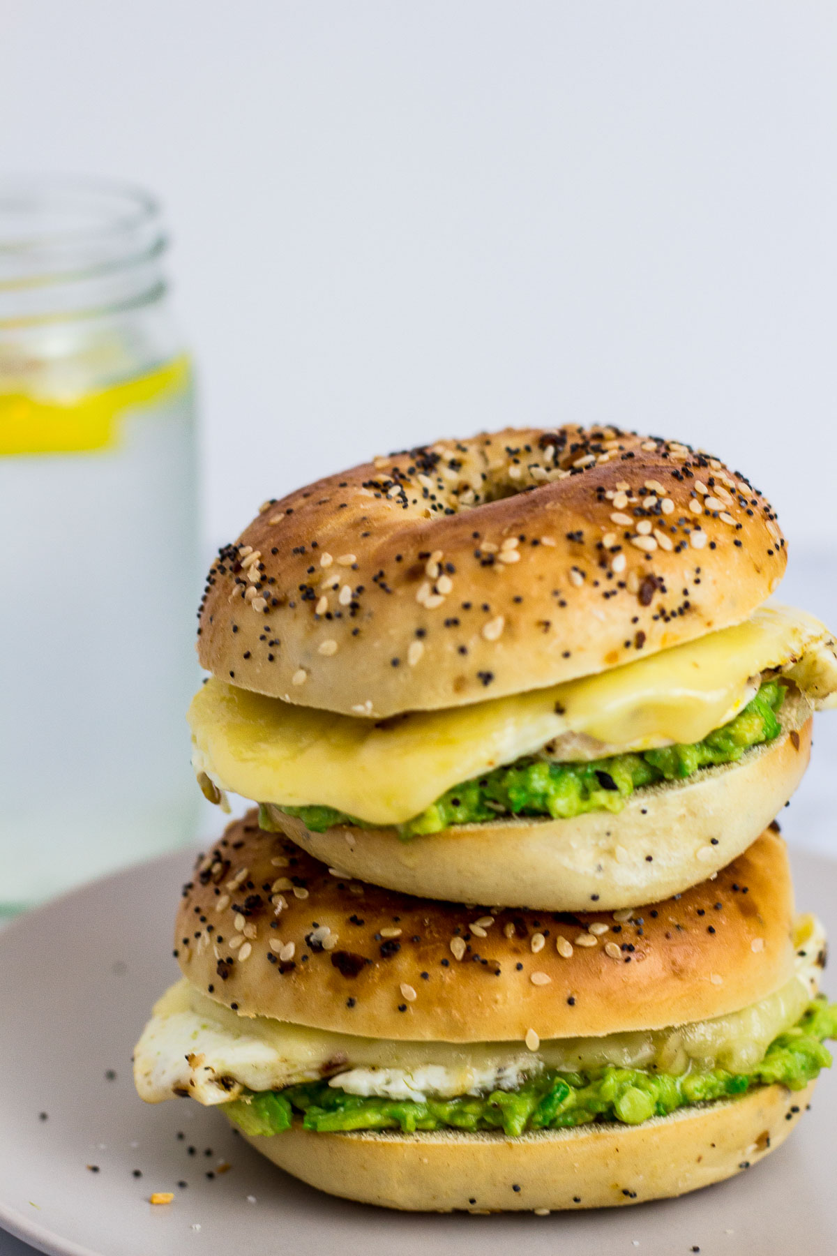 Straight shot of two bagel sandwich stacked on top of each other