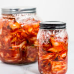 Glass jars of prepared kimchi, ready to be fermented