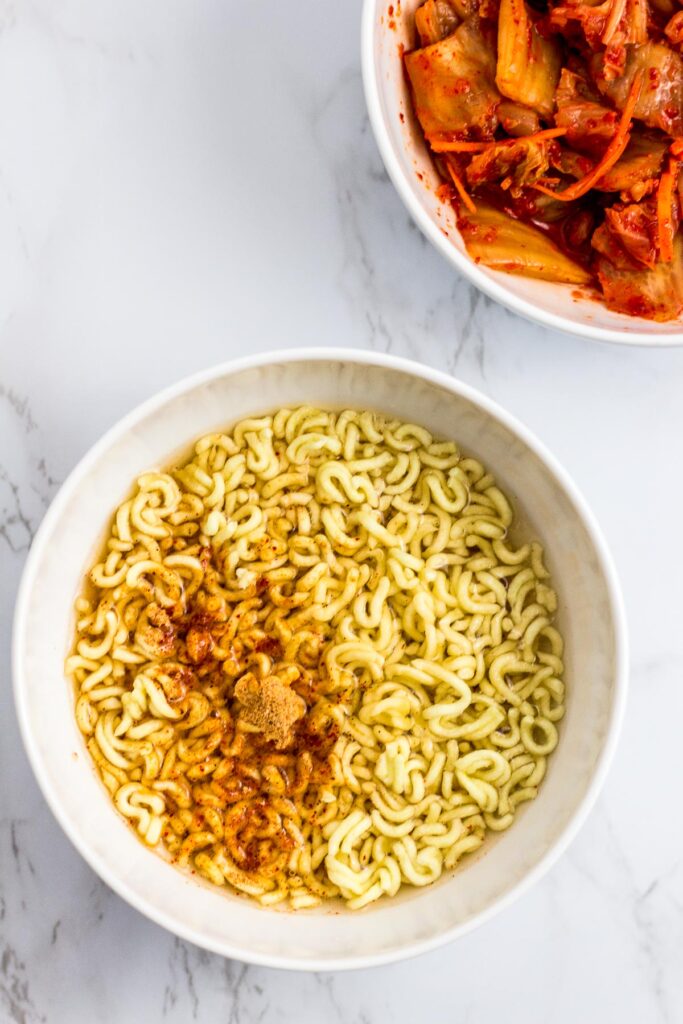 broken ramen noodle, water and soup base in the bowl before microwaving