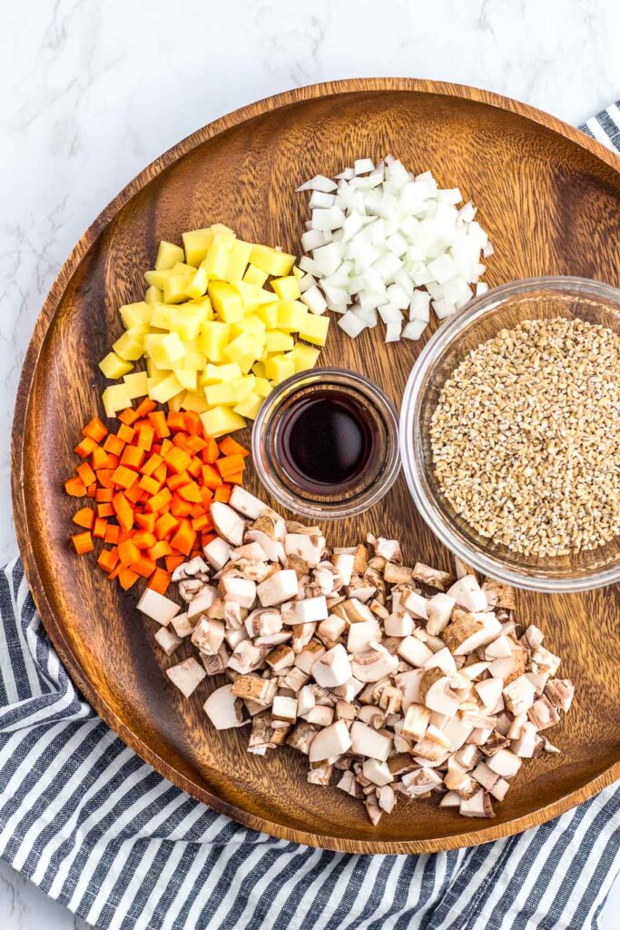 ingredients to make savory oatmeal - steel cut oats, onion, potato, carrot and mushroom