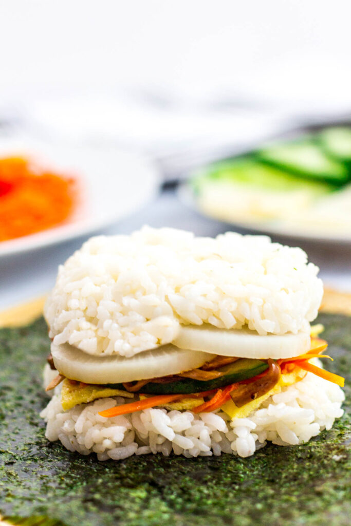 Kimbap rice sandwich on top of nori