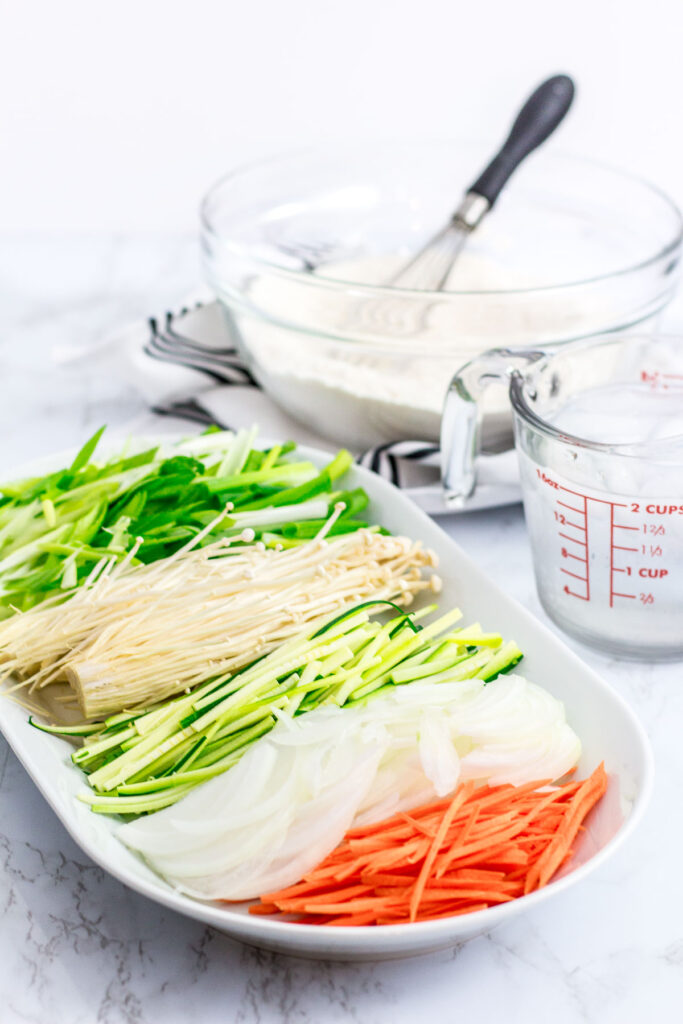 flour batter, scallion, enoki mushroom, zucchini, onion, and carrot