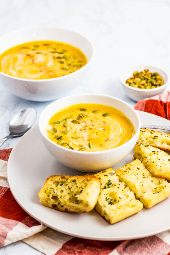 two bowls of creamy butternut squash soup