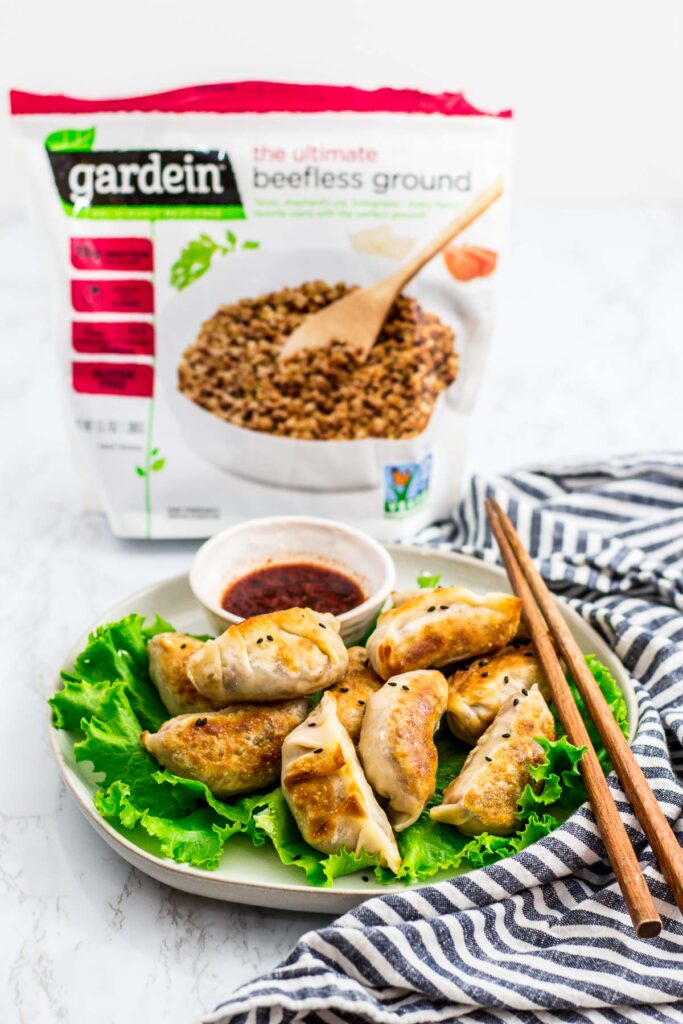 cooked vegan bulgogi mandu with Gardein beefless ground in the background