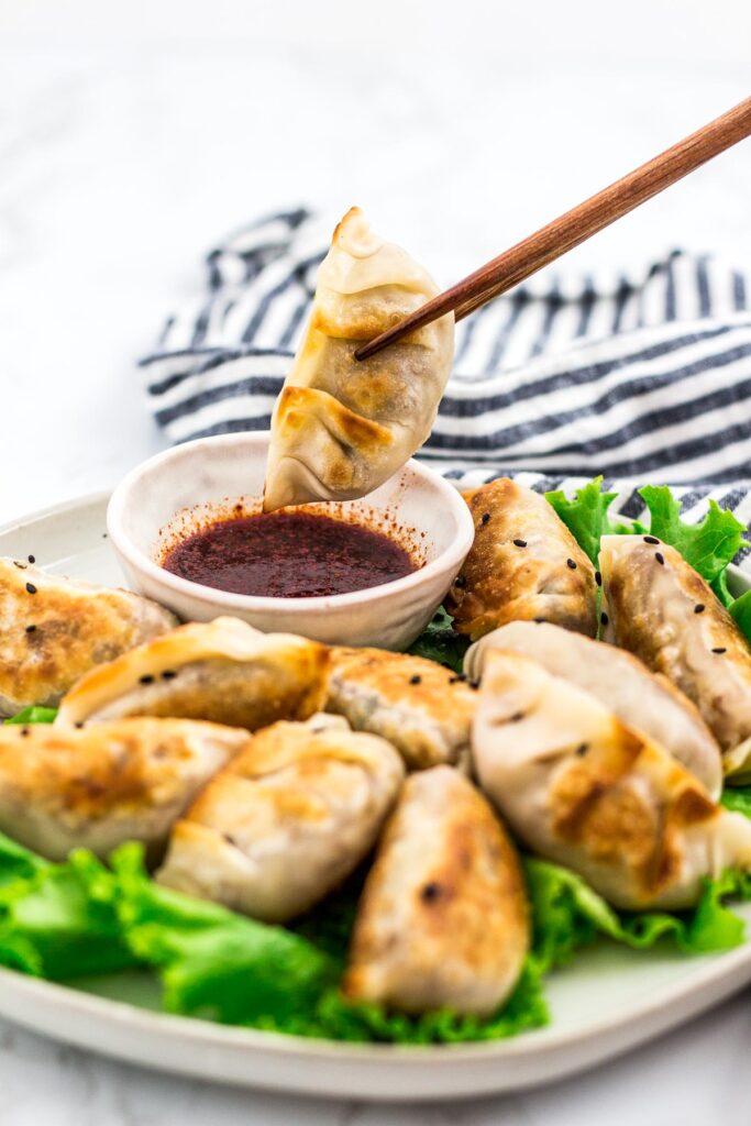 About to dip a mandu/dumpling into a sauce