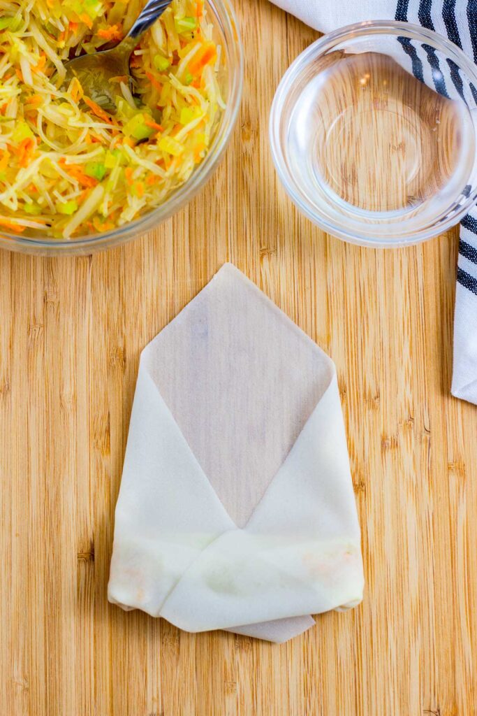 How to fold spring roll - step 6