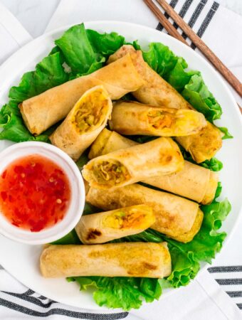 overhead shot of vegan spring rolls (vegan lumpia) with sweet and chili sauce