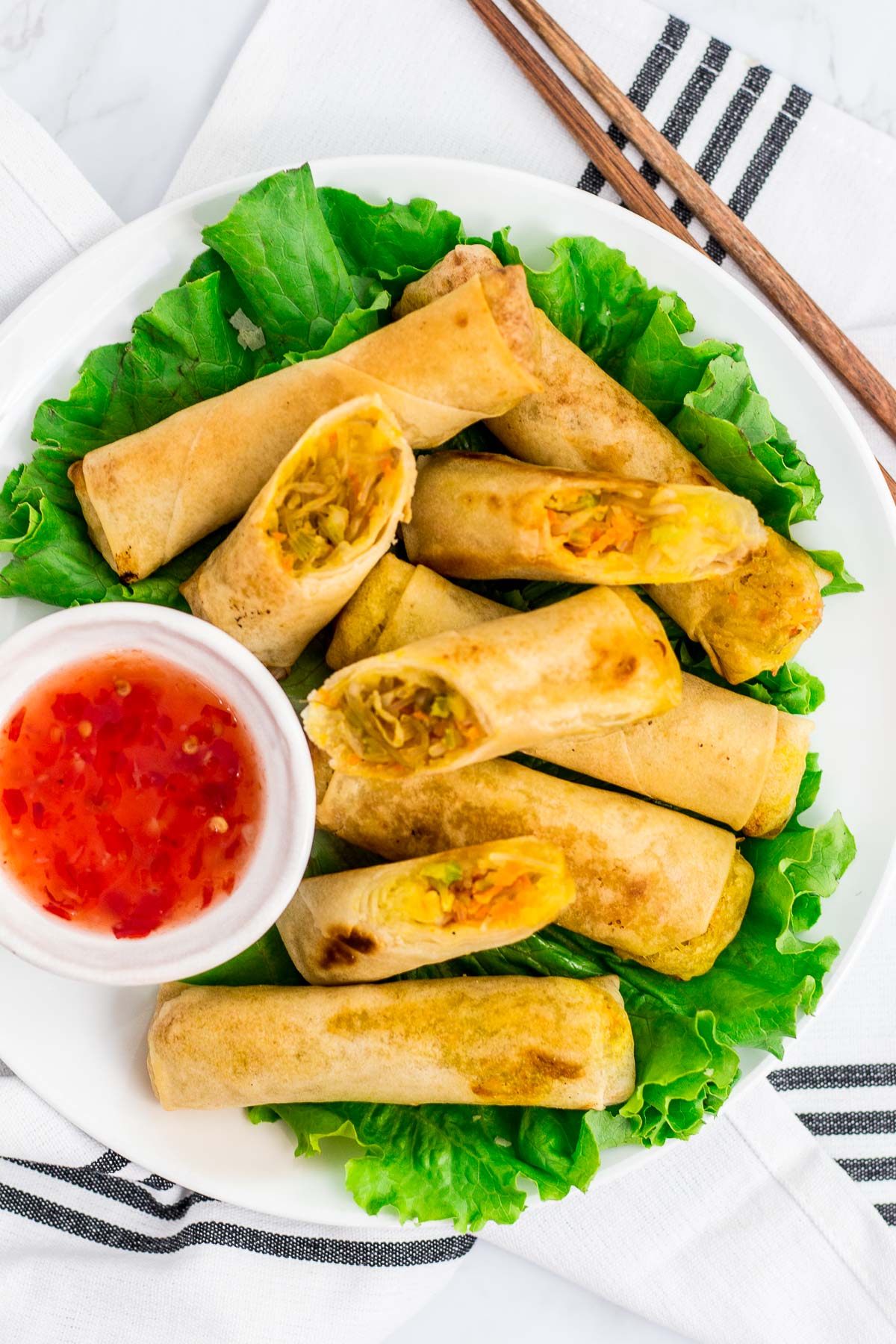 overhead shot of vegan spring rolls (vegan lumpia) with sweet and chili sauce