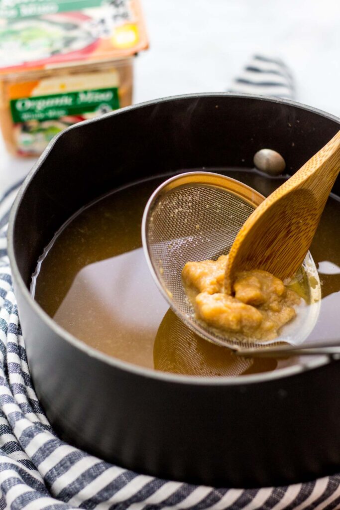 Dissolving miso into vegan dashi broth