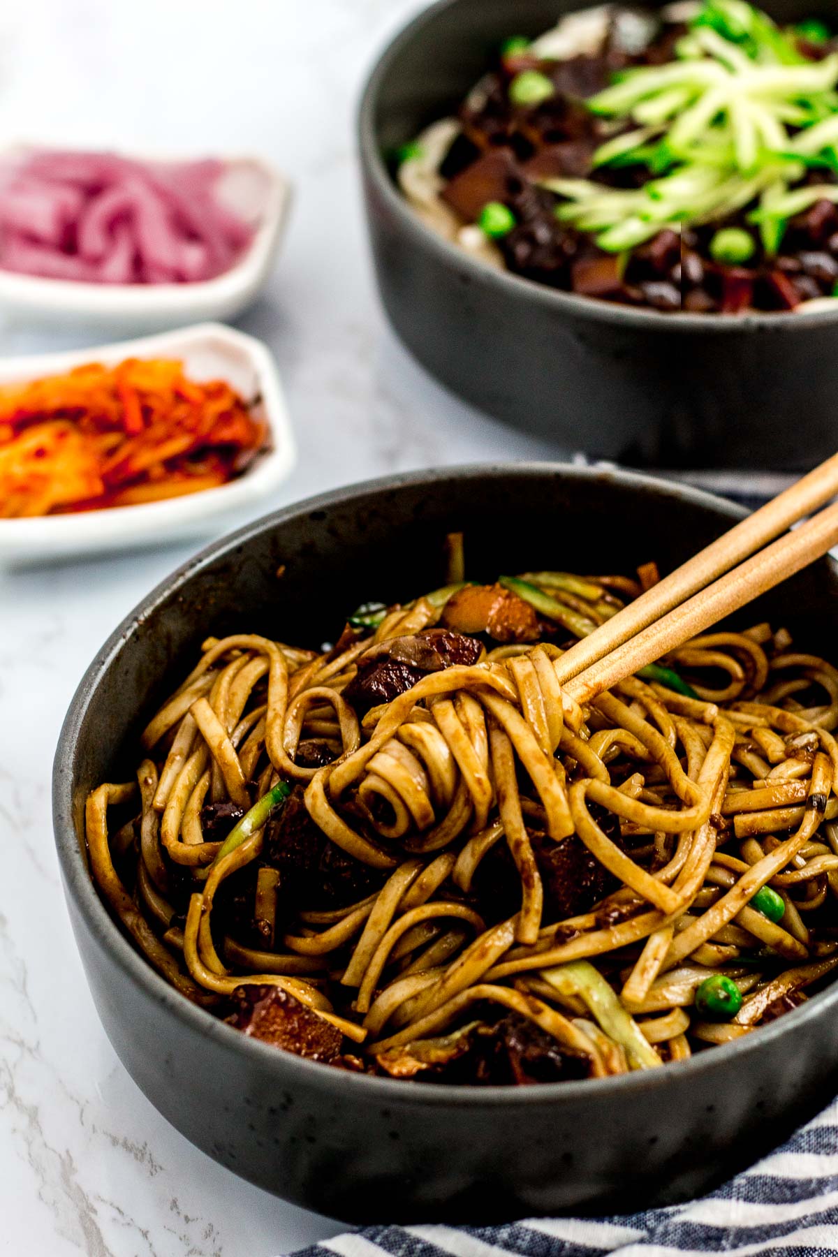 Mixed vegan jjajangmyeon (Korean black bean noodles) in a bowl
