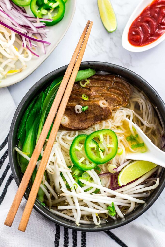 overhead shot of vegan pho with seitan slices