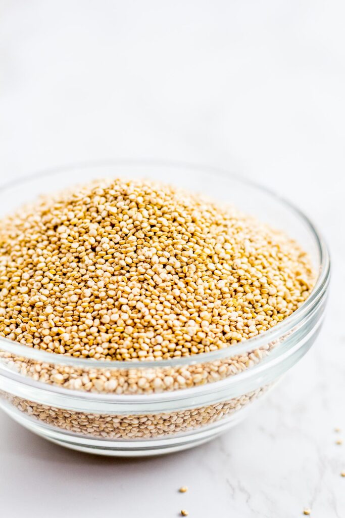 Uncooked quinoa in a clear bowl