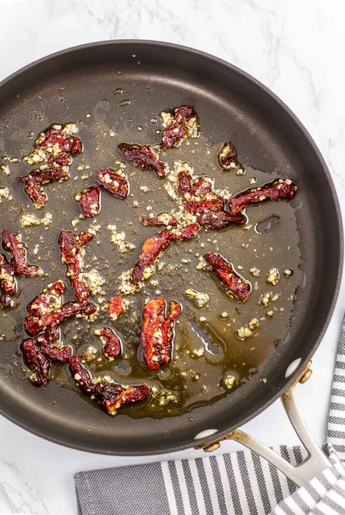 Minced garlic cooked in sun-dried tomato with olive oil