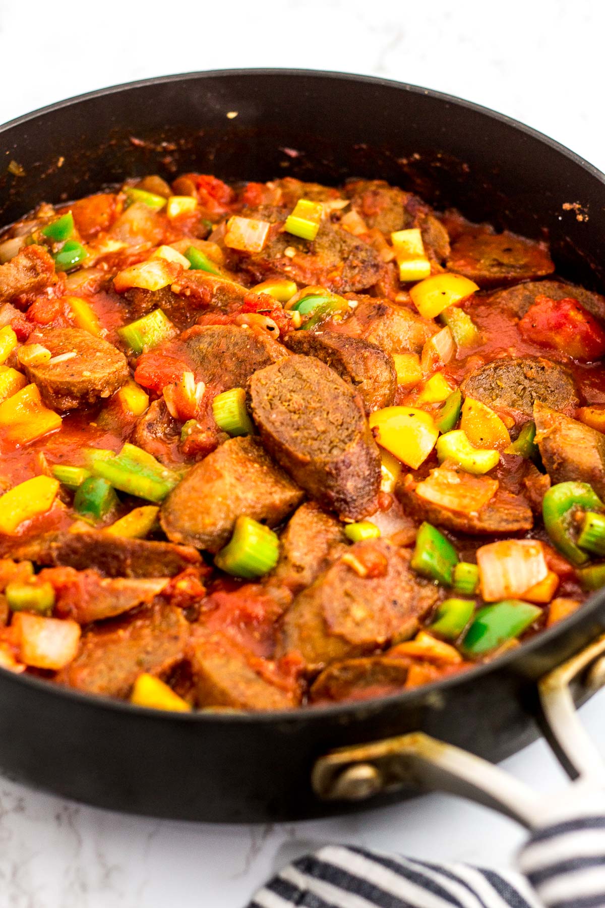 cooked vegan sausage added to the creole sauce