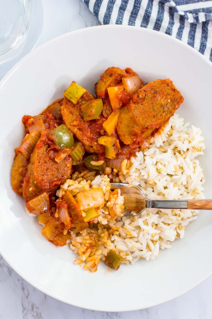 overhead shot of close up of vegan creole sausage cacciatore over rice