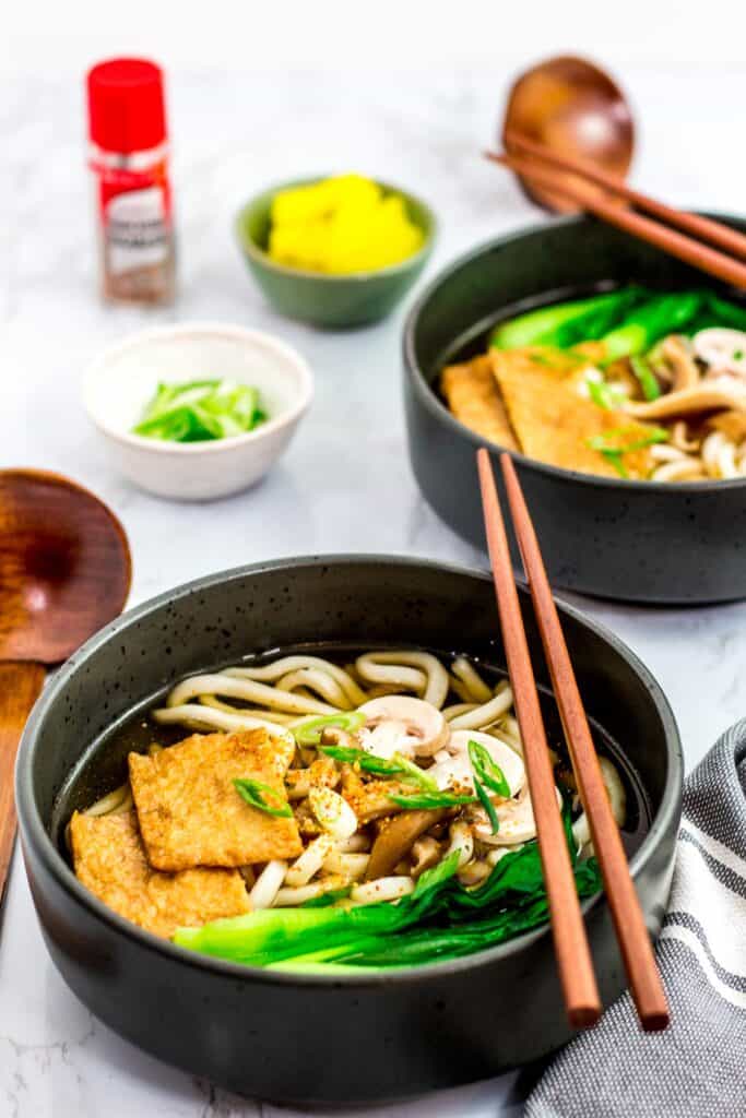 two bowls of vegan udon noodle soup