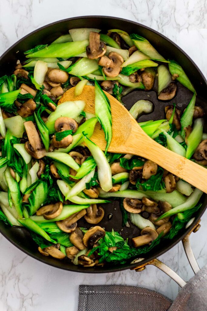 cooked bok choy and mushroom in the pan