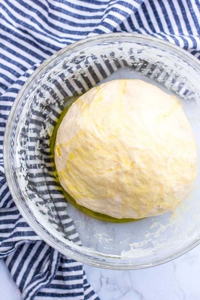 Hand kneaded dough covered in extra virgin olive oil