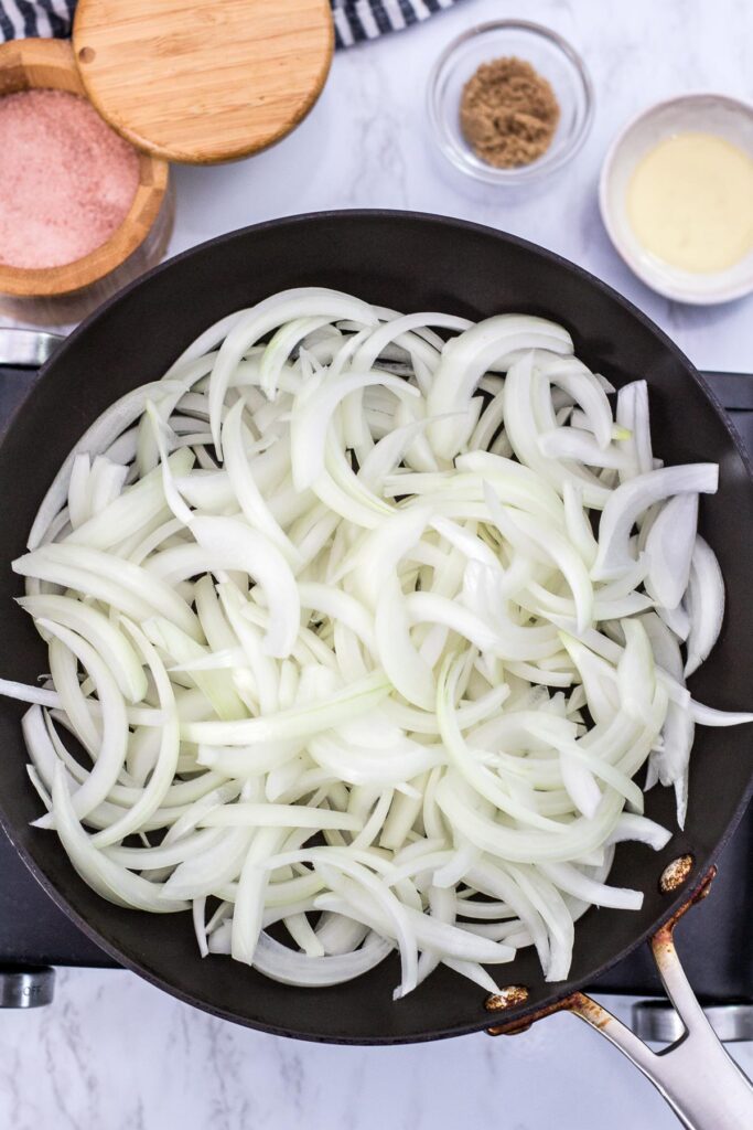 sliced onion in the pan without any oil