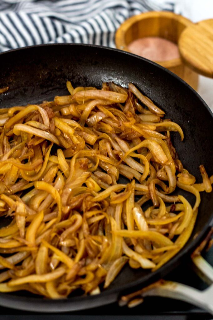 caramelized onion being cooked in a pan