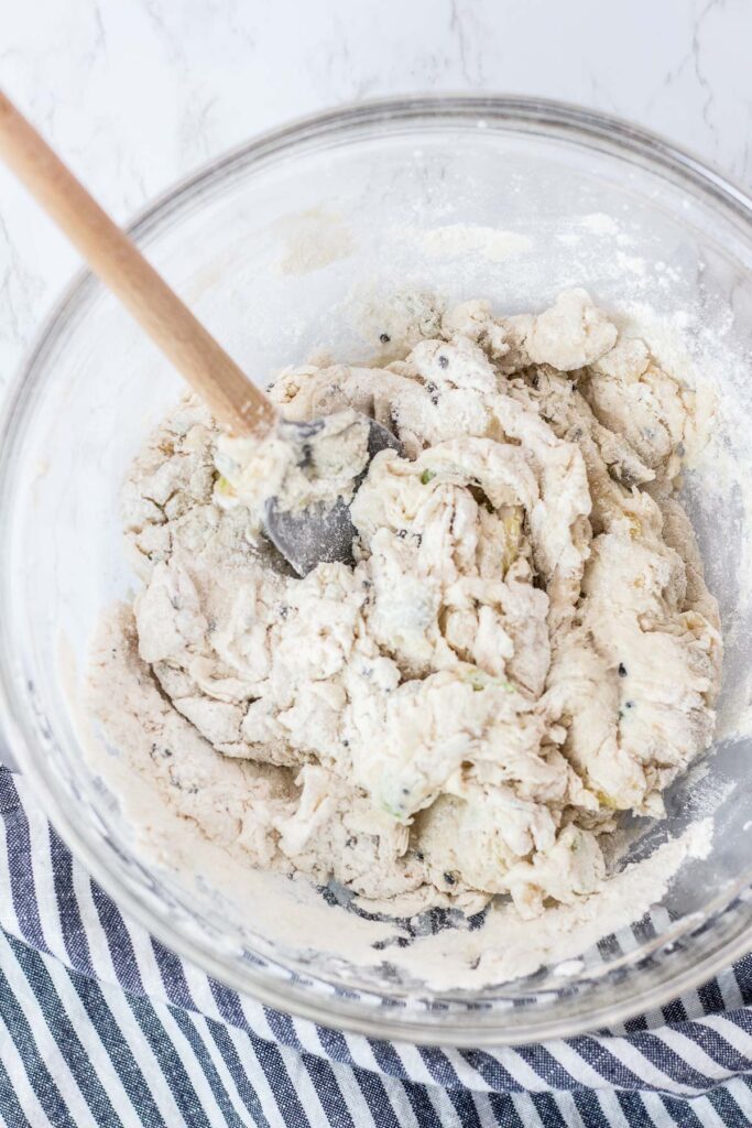 focaccia dough being mixed with rubber spatula