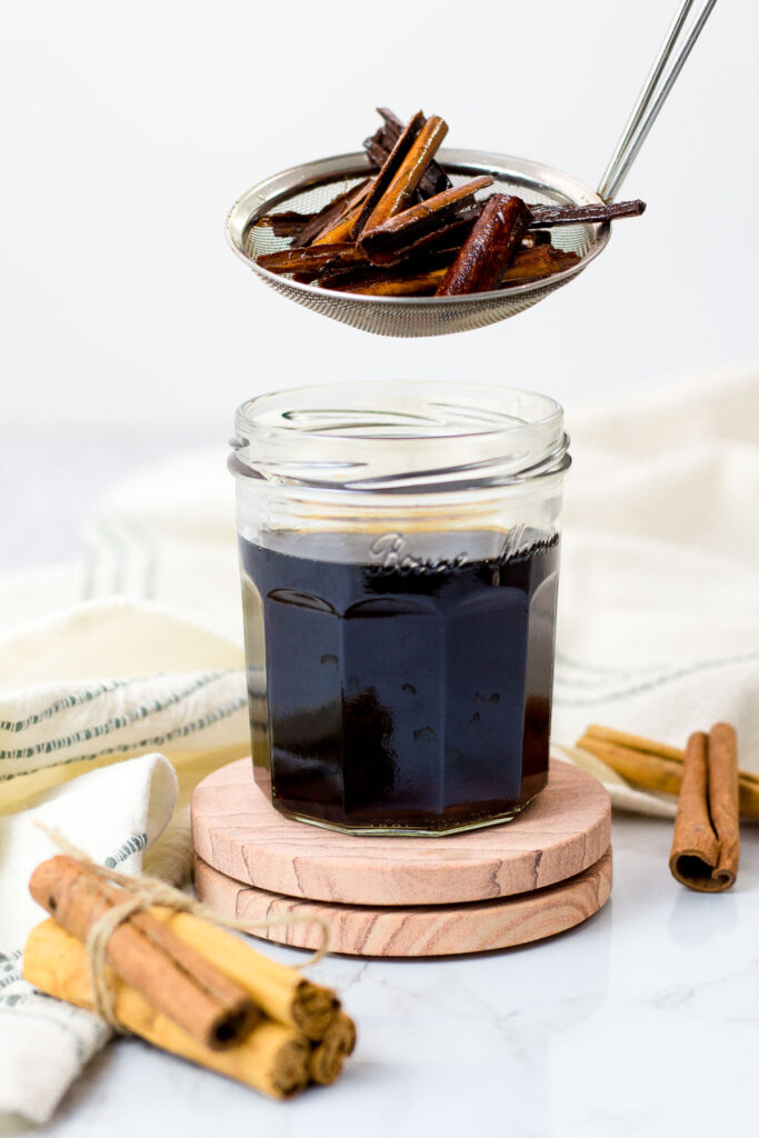 straining cinnamon syrup