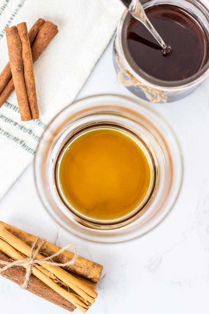 overhead shot of cinnamon syrup in a glass