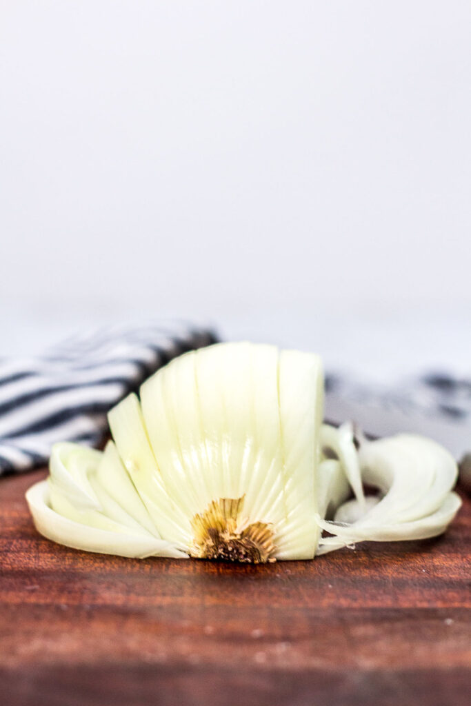 straight shot of sliced onion from the bread part of the onion side