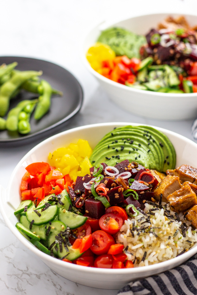 two bowls of vegan beet poke bowls