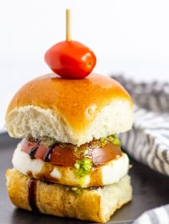 close up shot of caprese cold sliders with balsamic glaze