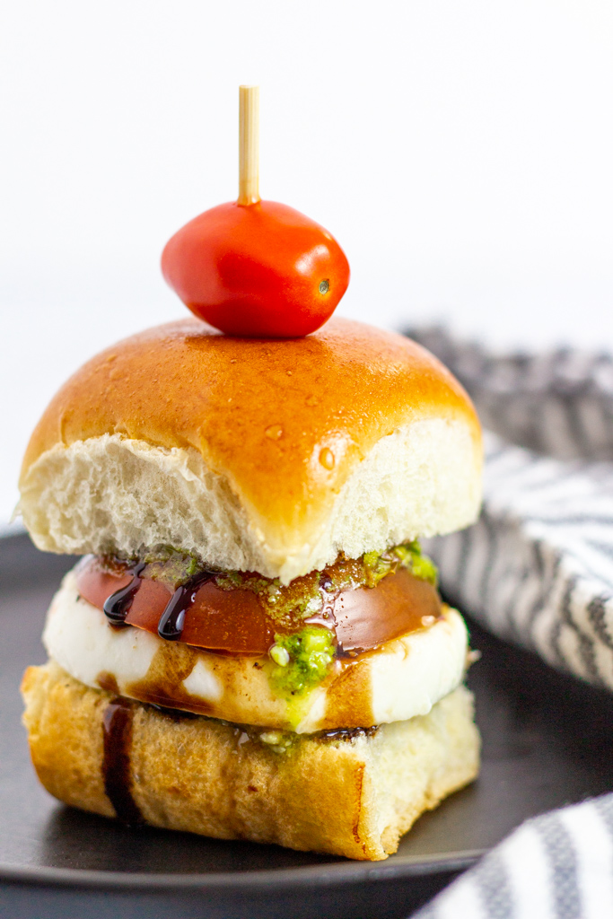 close up shot of caprese cold sliders with balsamic glaze