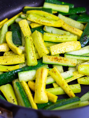 sauteed zucchini and yellow squash in a non-stick pan seasoned with black pepper