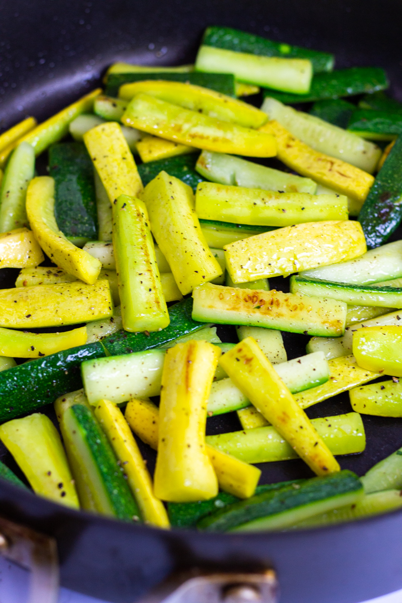 sauteed zucchini and yellow squash in a non-stick pan seasoned with black pepper