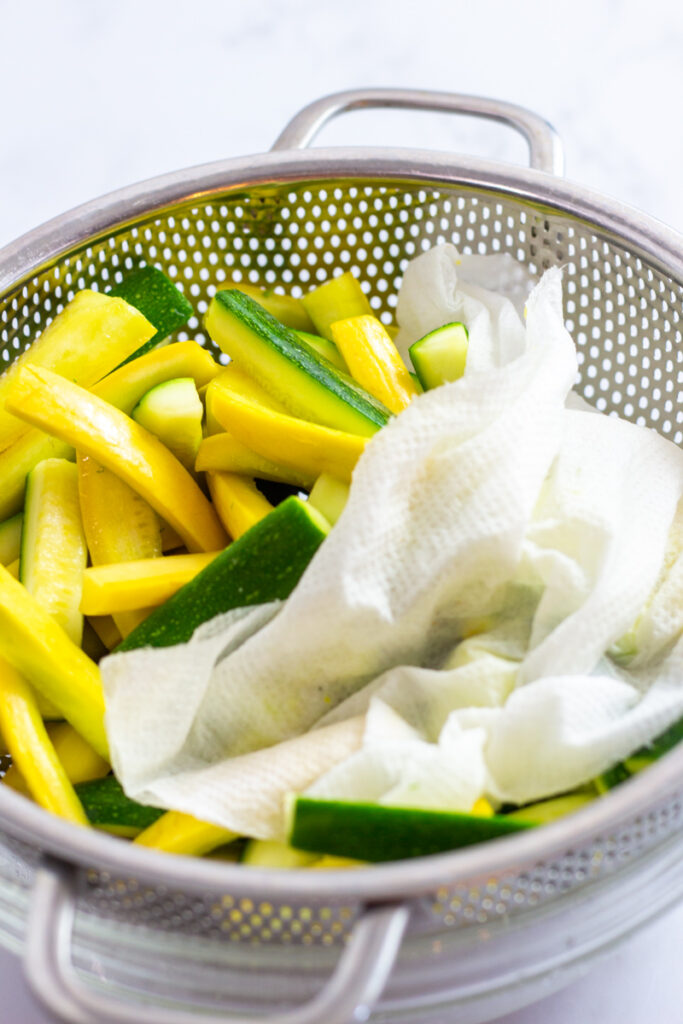 patting the salted vegetables dry with a paper towel.