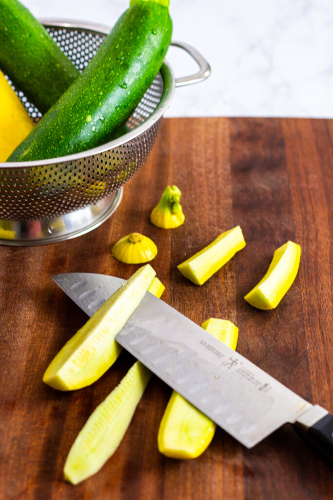 removing the yellow squash seeds with a knife.