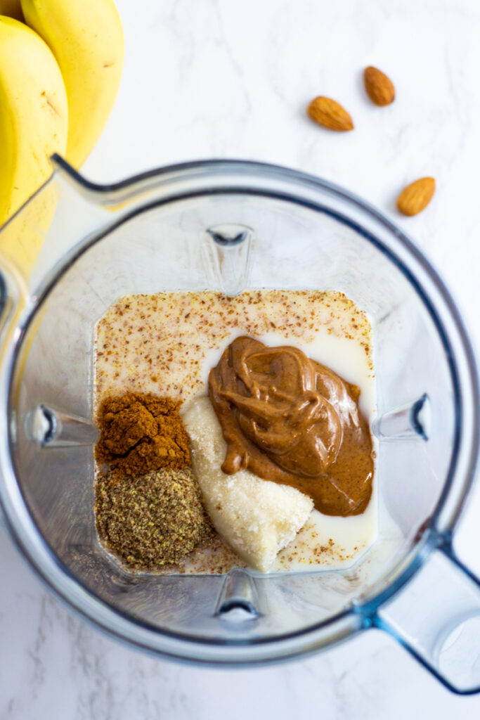 almond butter, almond milk, frozen banana, ground flaxseeds ,and cinnamon powder in a blender.