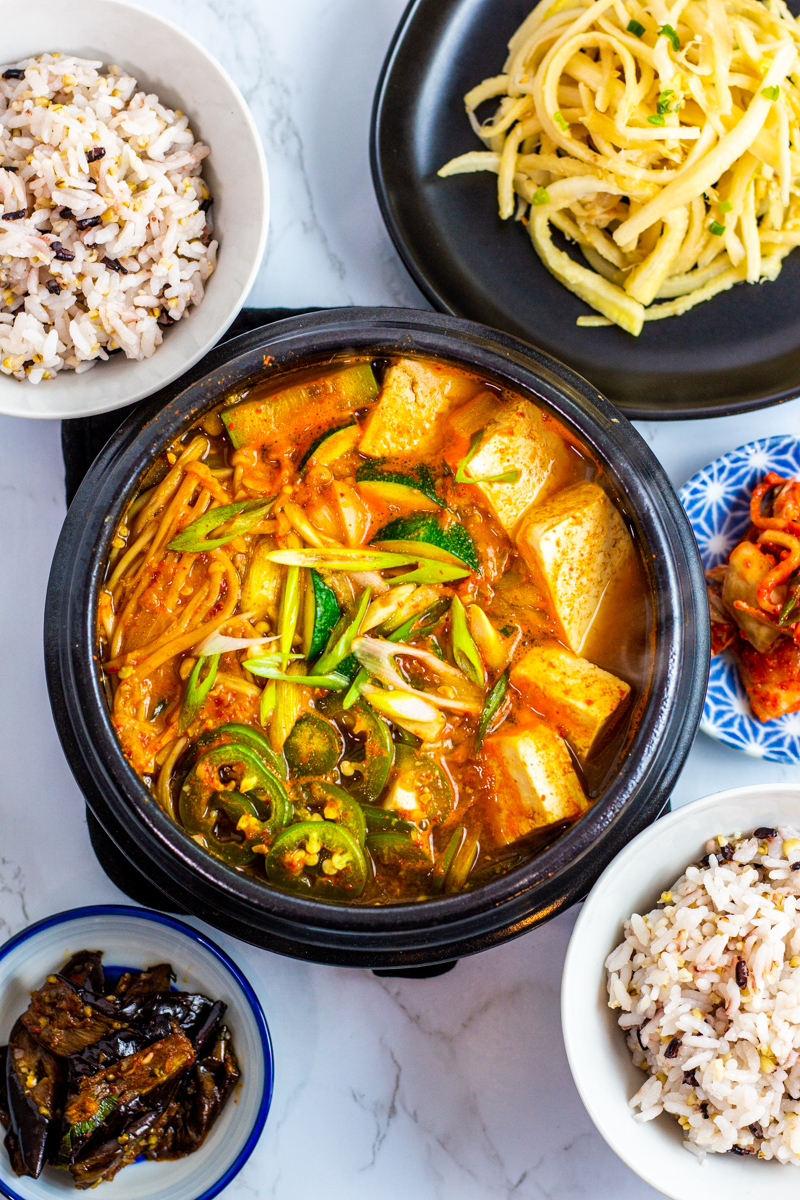 doenjang jjigae with other korean side dishes and rice.