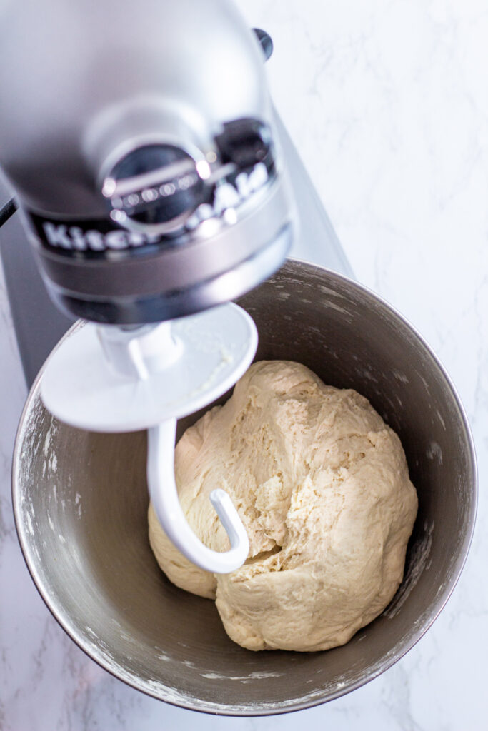 finished pizza dough in the stand mixer bowl