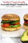 avocado bagel sandwich with tomato and cucumber.