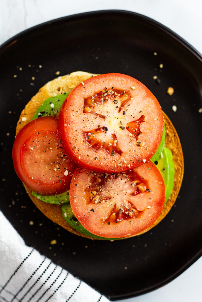 tomato slices on top of avocado.