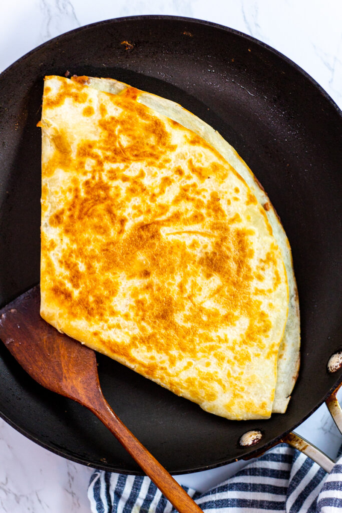 cooked quesadilla on the pan.