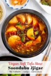 overhead shot of Vegan Soondubu jjigae with other Korean side dishes around.