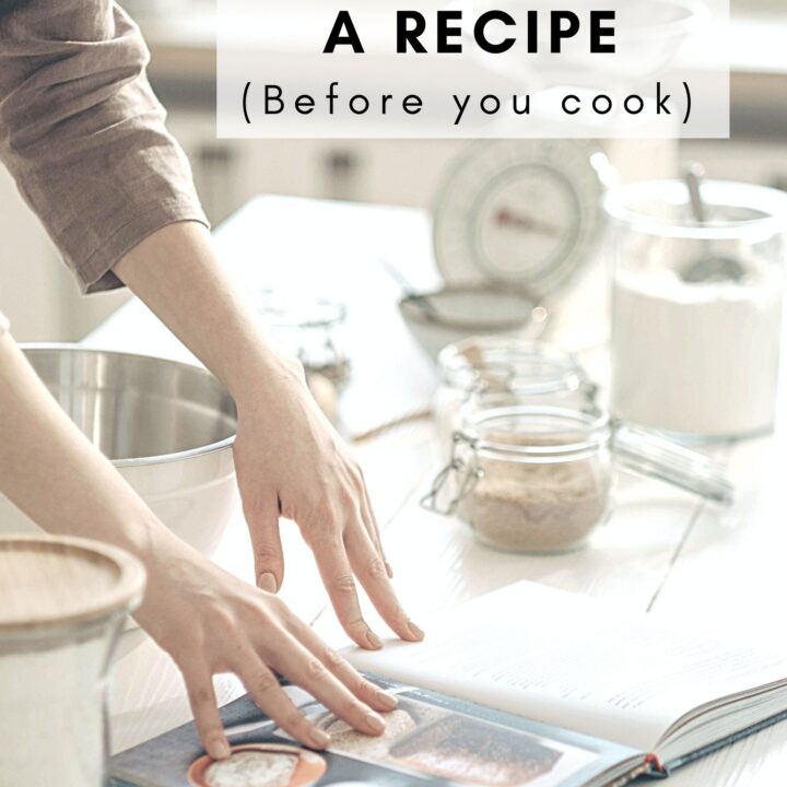 A person reading the recipe carefully.