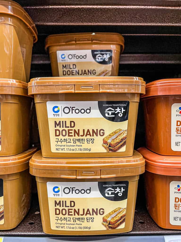 O’Food Mild Doenjang Korean soybean paste in brown tub on grocery shelf