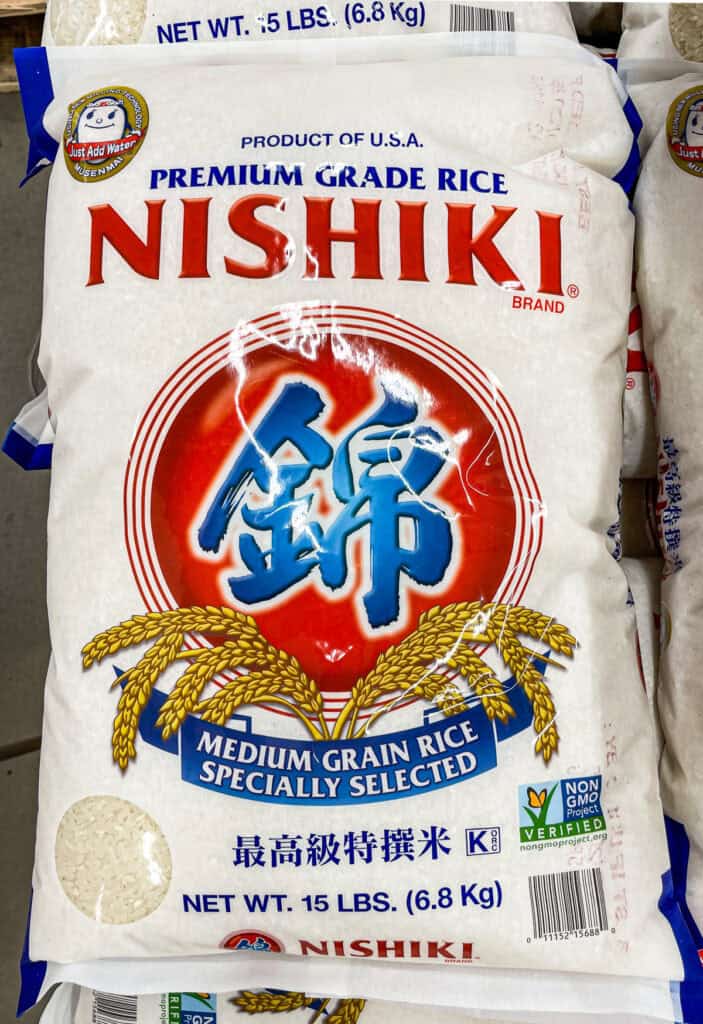 Bag of Nishiki brand medium-grain rice, a popular choice for Japanese cooking, on a grocery store shelf.