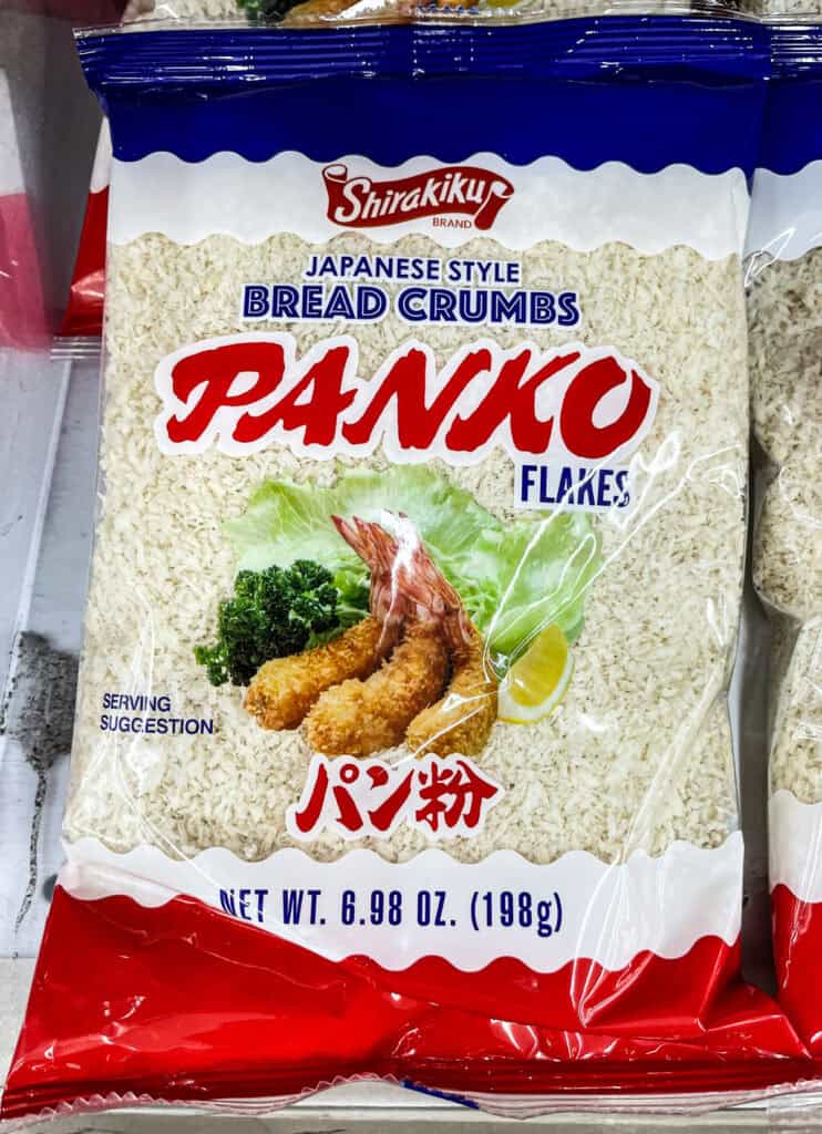 Close-up of Shirakiku brand Japanese-style panko bread crumbs package, showing crispy shrimp serving suggestion on the label.