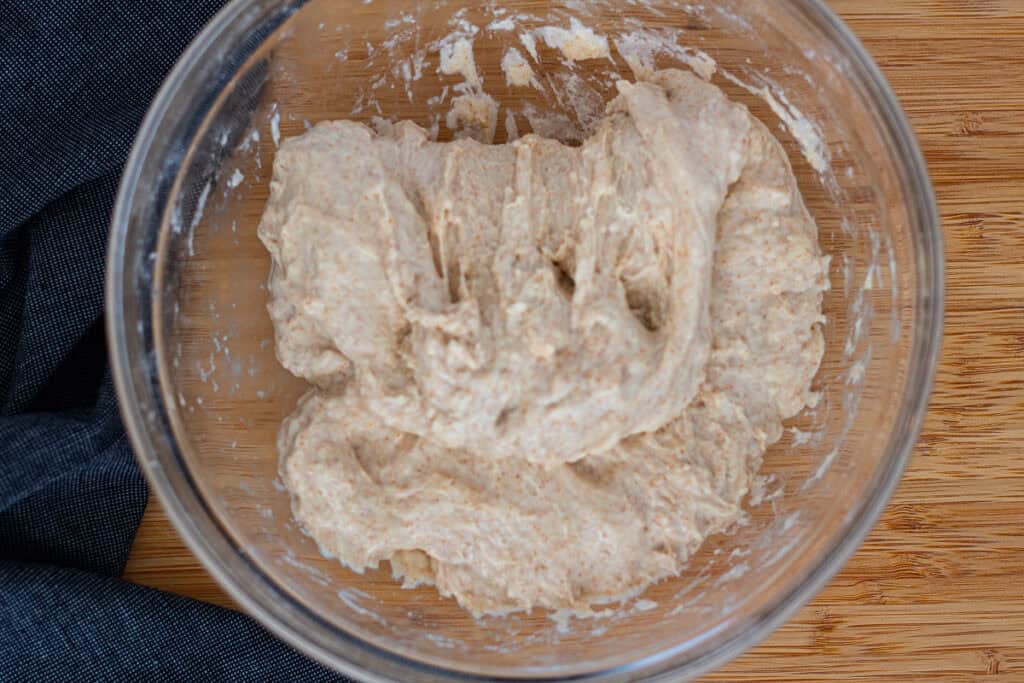 First fold of the dough shown from a different angle during the initial bowl fold set.